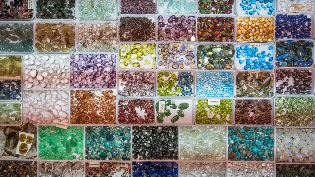 Colourful gemstones arranged in sales trays