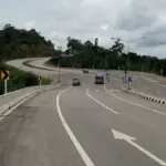 Curving highway through green hills in Thailand
